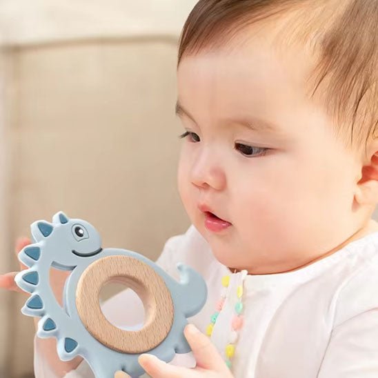 anneau de dentition réfrigéré dino bébé main bleu